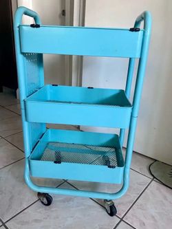 Blue rolling storage cart.