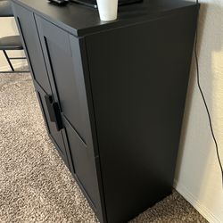 Two black cabniets, entertainment center with drawers, and dining table (only) that fits 6.