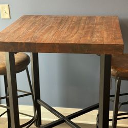 Reclaimed Wood Table and Bar Stools (2). - Pottery Barn