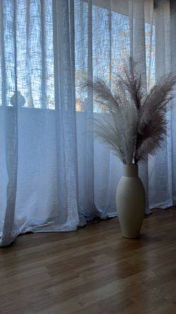 Crate and barrel tall decorative urn with Pampas grass