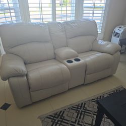 Italian leather couch and love seat and i've pulled out chair