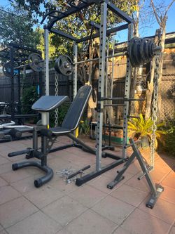 OLYMPIC SQUAT RACK WITH OLYMPIC WEIGHTS AND BENCH