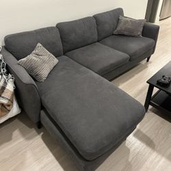 Dark Gray Living Spaces Aya Sectional Sofa (Reversible Chaise)