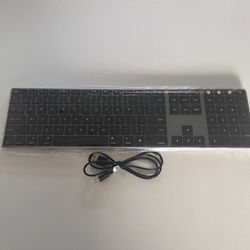 The Jelly Comb Wireless Multi-Device Keyboard is a slim, black keyboard designed for use with Mac computers.