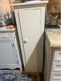 Solid Wood Shabby Chic Storage Cabinet  Solid wood shabby chic storage cabinet with four shelves and plenty of storage. Measures 49 inches tall, 17 in