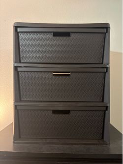 Two brown plastic storage drawers