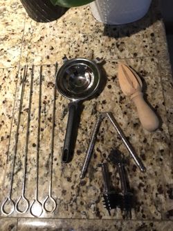 Skewers, egg yolk separator, oil & vinegar bottle spouts, nut cracker, and citrus juicer