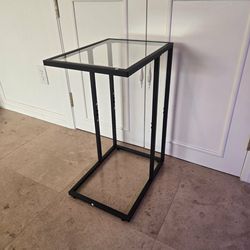 Brand new glass C-shaped side table
