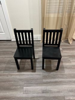 2 wooden kids chairs boo