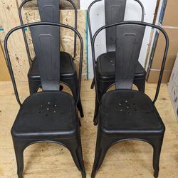 Four Metal Stackable Bistro Chairs
