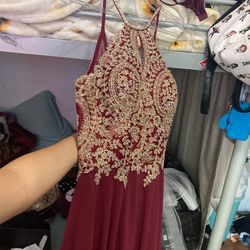 Long slit burgundy dress can be used for homecoming or prom 