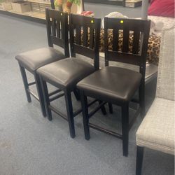 Three black barstools in excellent shape