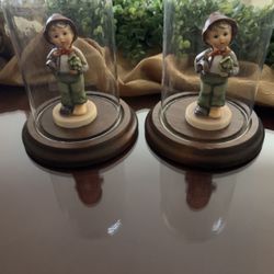 2 Hummel Figures In Glass Case. Sells For $90 Each On Amazon. I’m Asking $50 For Both!