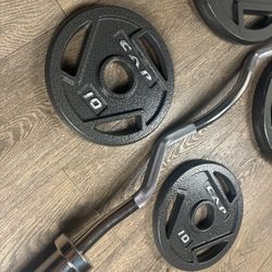 Beautiful BRAND NEW Curl Bar With Pair Of 25s And 10s 