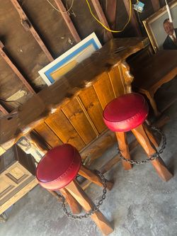 Rustic Wood Bar with Two Red Stools