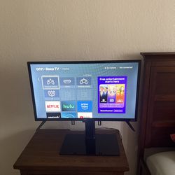 Onn 32” TV- Roku smart TV with Tv Stand