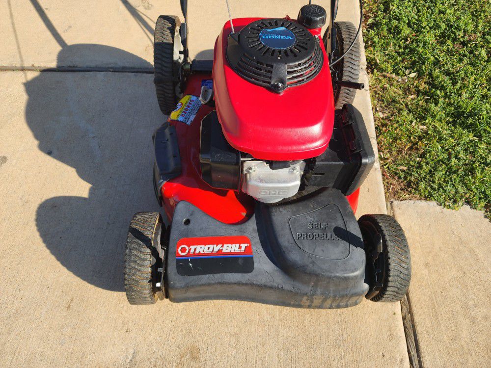 Two Troy Bilt Mowers With Honda Engine On Them 
