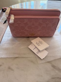 Authentic Coach Light Pink Del Zip Wallet in Signature Canvas.