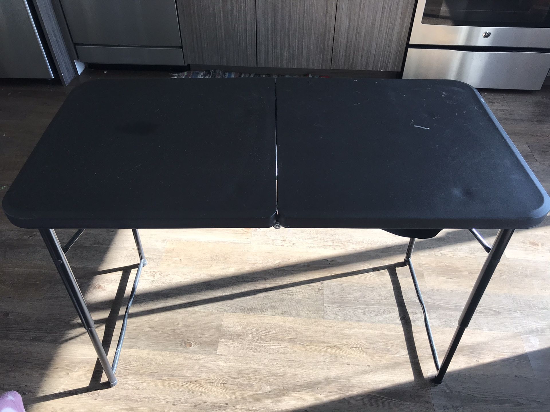 Adjustable height table with table cover