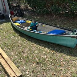 Canoe + Paddles + Life Vests + Anchor 