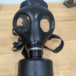 Black gas mask with clear eye lenses.