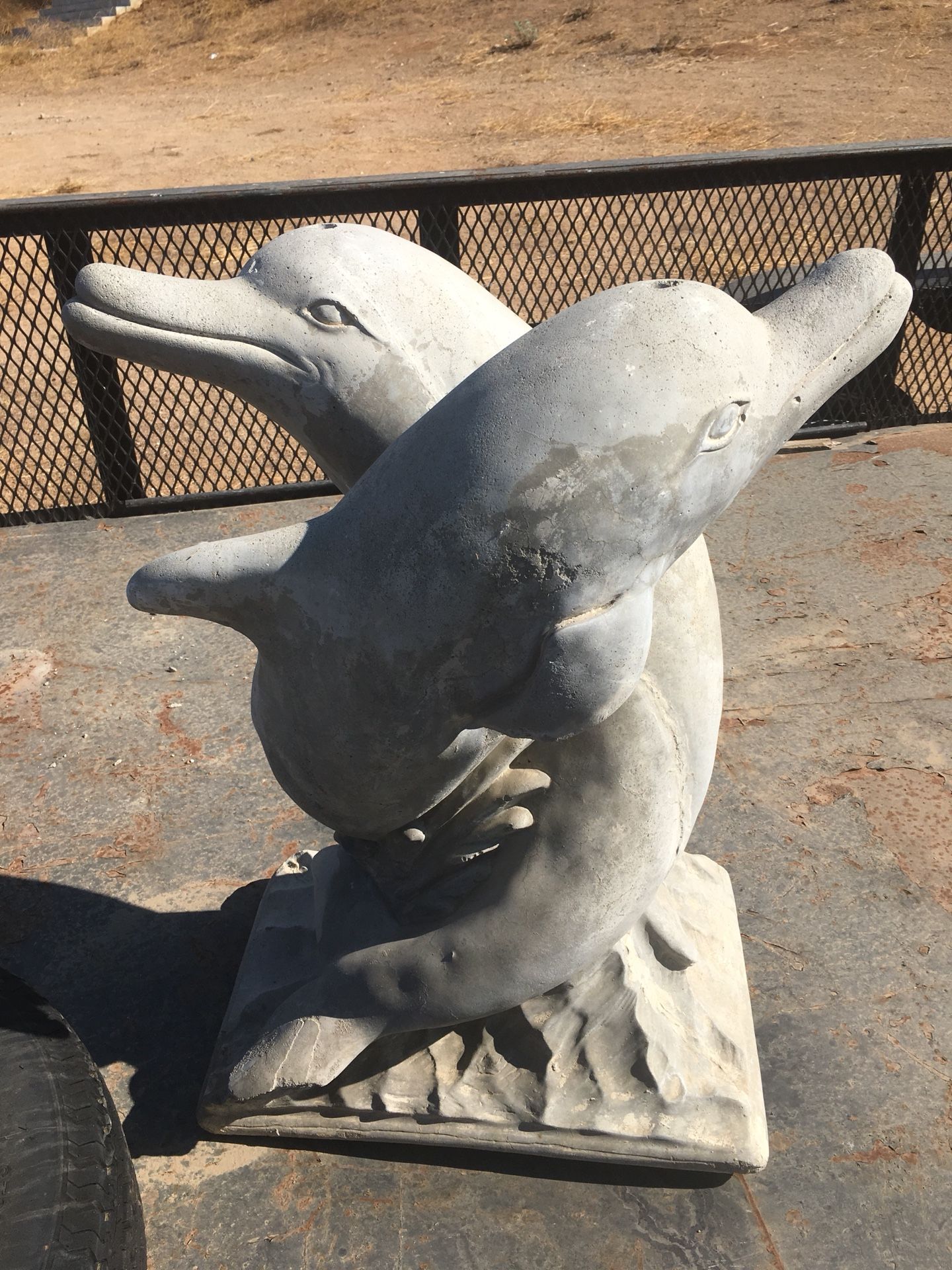 Dolphin water fountain statue