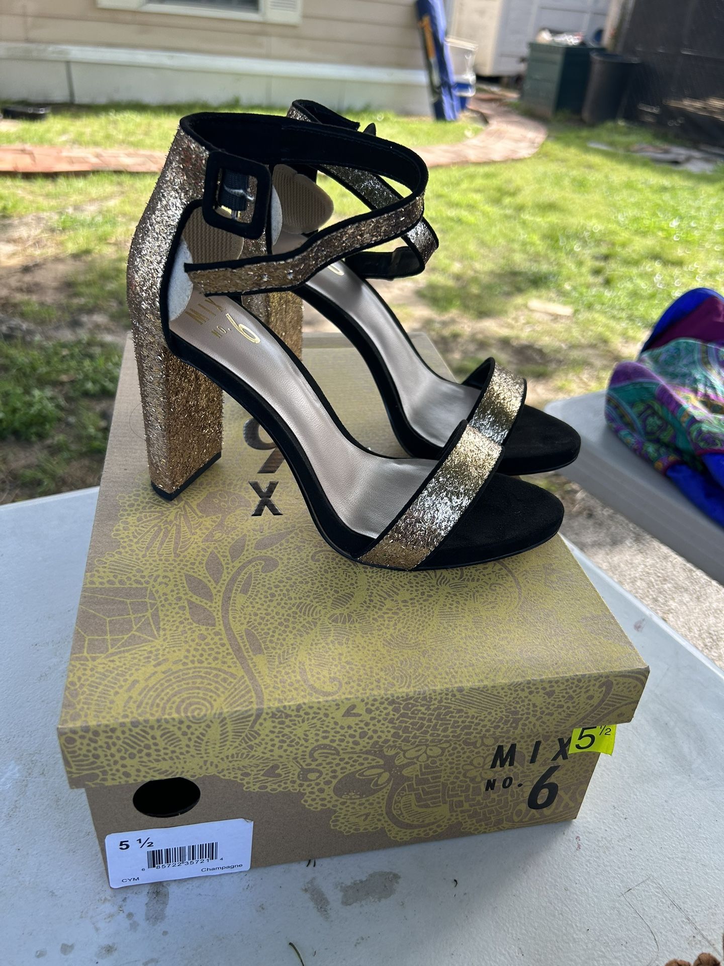 GOLD AND BLACK HEELS