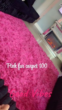 Pink furry rug