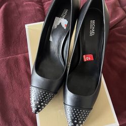 Two Michael Kors shoes