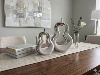 ceramic white body and polished silver accents.