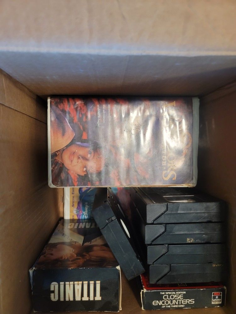 Over 100 Assorted DVD'S and VHS'S Collectibles