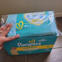 Newborn Pampers and Changing pad 