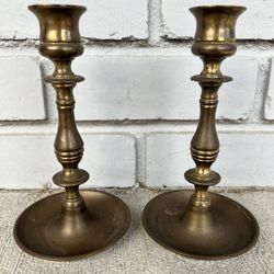 A pair of old English brass candle holders / sticks. Made in England.