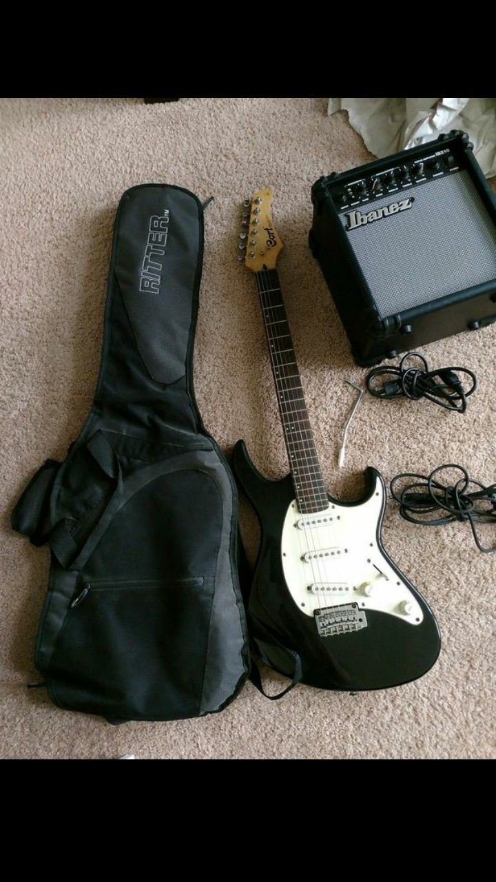 Vintage Cort Electric Guitar with Ibanez IBZ10 amp and Ritter bag.
