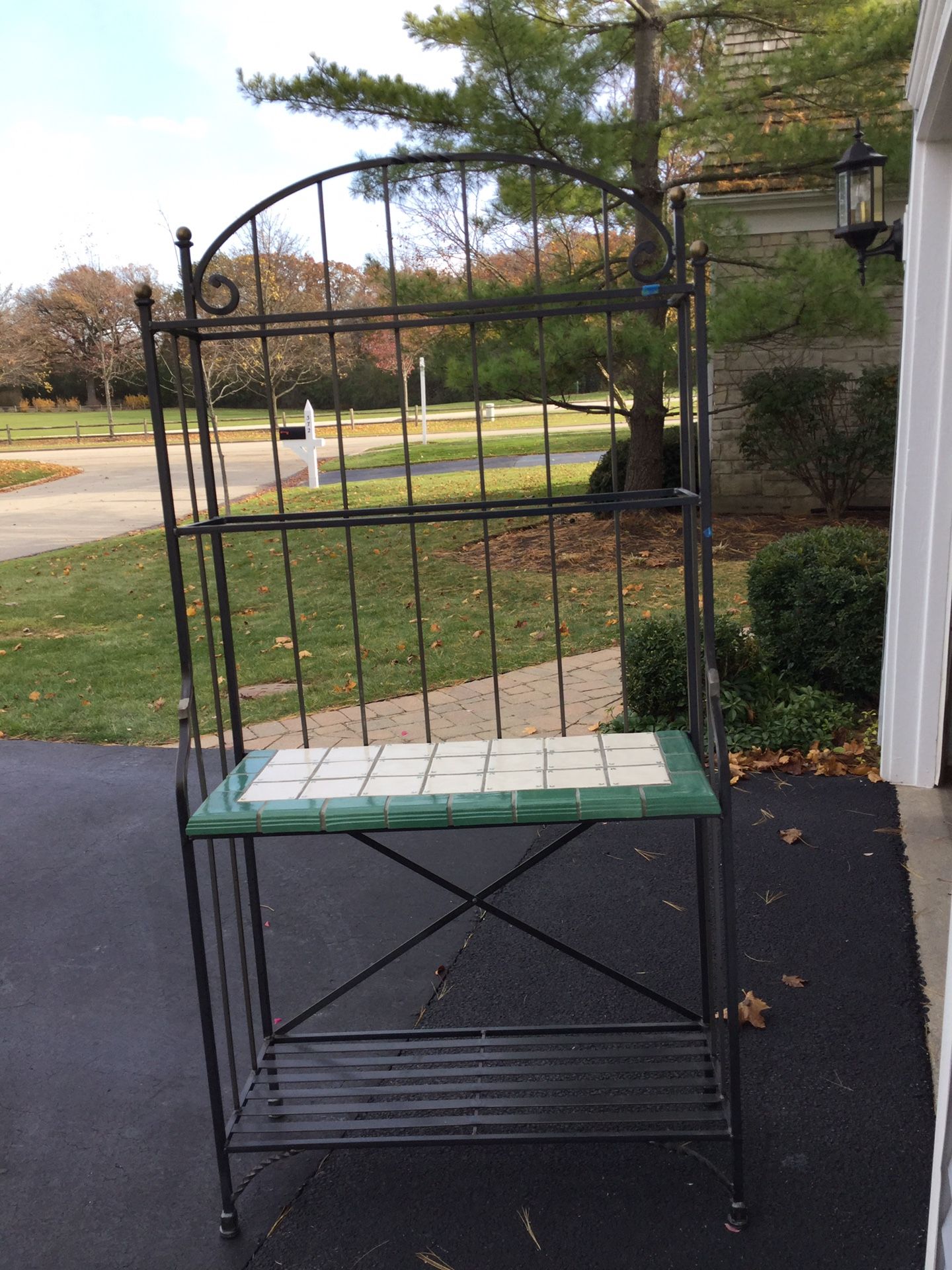 Wrought iron and ceramic top Bakers Rack