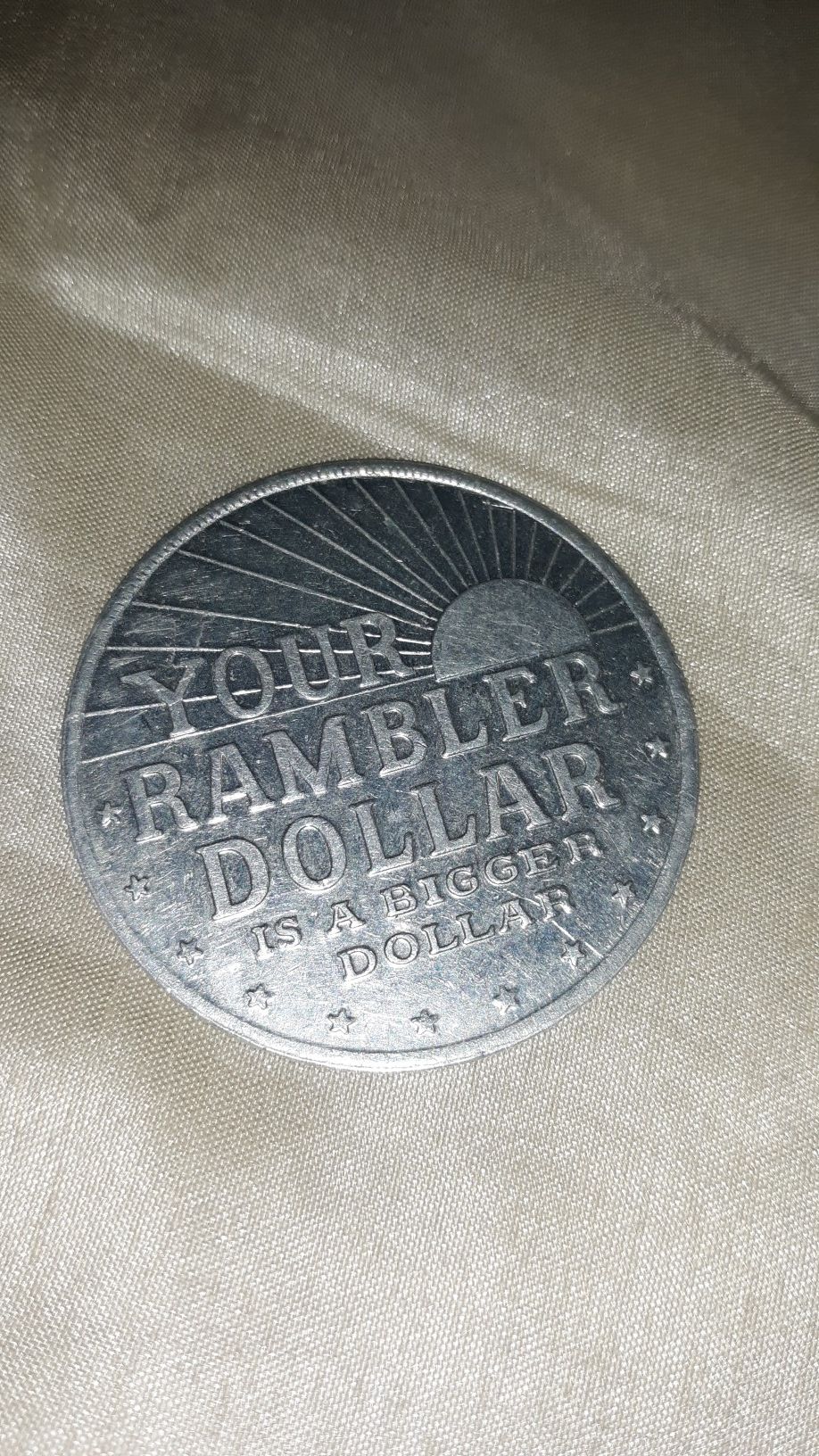 Rambler dollar advertising coin