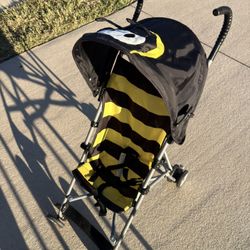 Selling a great umbrella stroller, bee-themed.