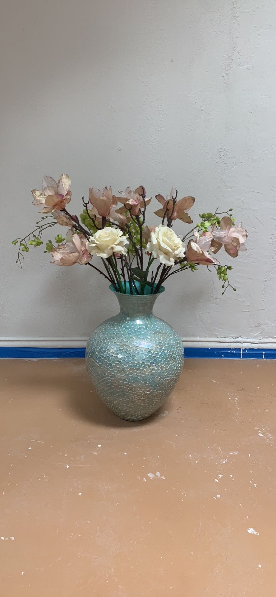 Blue mosaic vase and flowers