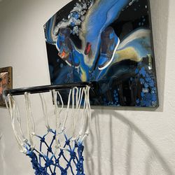 Basketball hoop with sneaker art