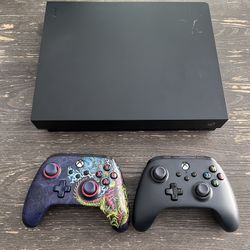 Xbox One X w/ Kinect, 20 games, and 2 remotes
