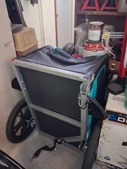 Dog carrier behind bike