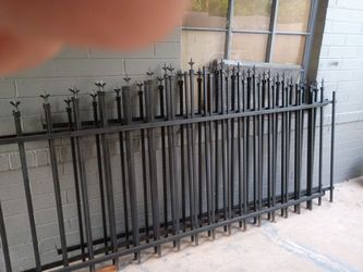 Heavy 1"cross bars and 3/4 "uprights wrought Iron fencing.