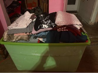 Bin of women’s men’s clothing bundle