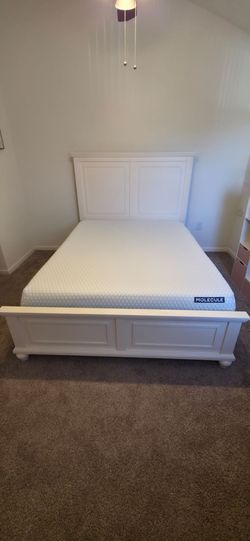 Molecule Mattress and White Wooden Bed Frame by Rooms To Go