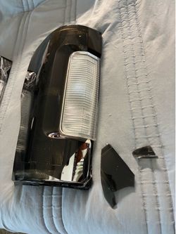 Free damaged driver-side taillight. Matching passenger-side taillight available separately for $50.