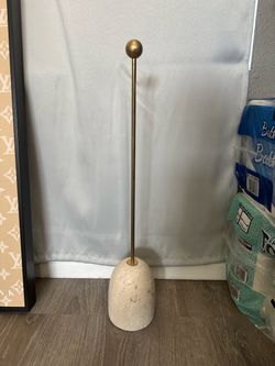 CB2 travertine door stopper