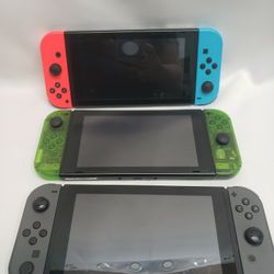 Nintendo Switch Units Green, Black And Blue/ Orange.