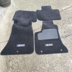 Original floor matts for a 2012 Chrysler 300