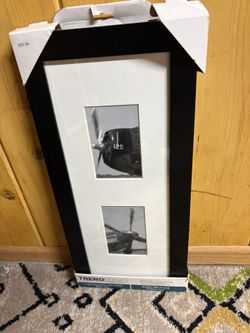 Trend Curves photo frame is designed for displaying two vertical photos and features a sleek black border