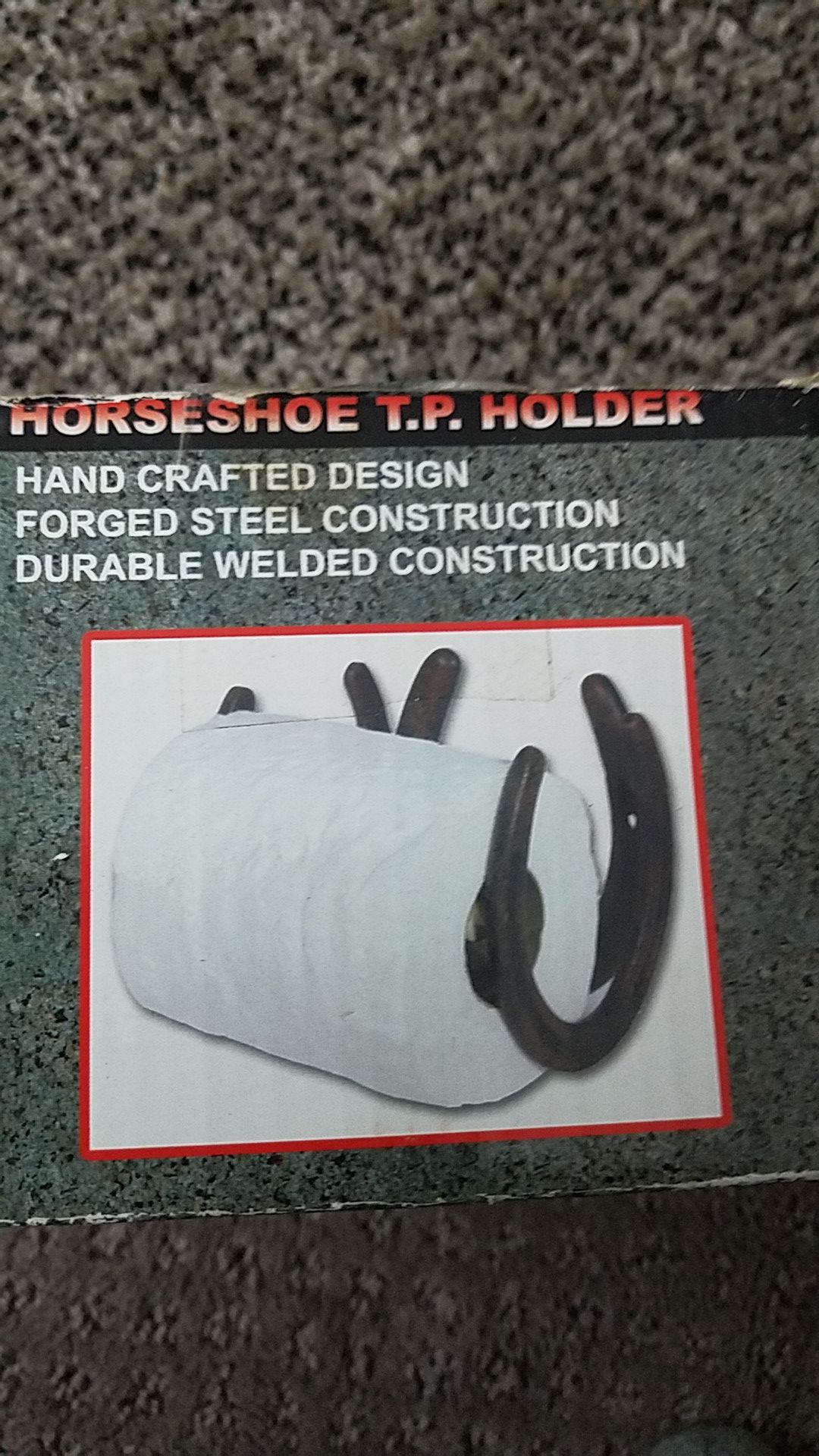 Horseshoe toliet paper holder